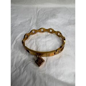 Michael Kors Gold Tone Hinged Bangle Bracelet with Padlock Charm